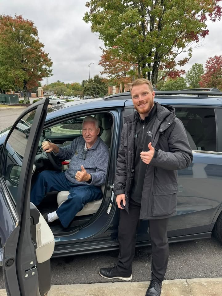 Luke Laliberte handing over the keys to a client