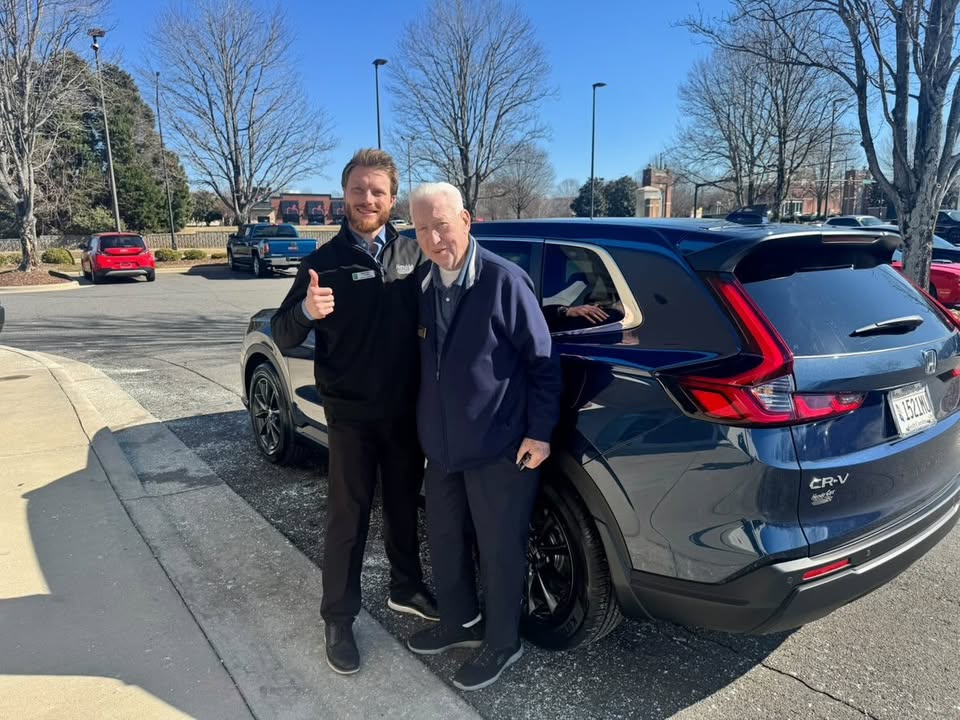 Luke Laliberte with a client and his new Honda CR-V